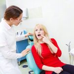 A patient discussing root canal therapy treatment at Burlington Ontario dentist